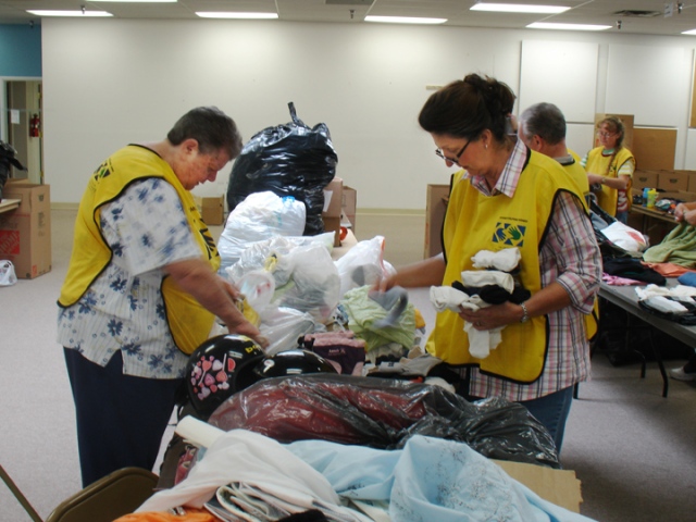 Barbara Stogsdill of Erie and Linda Eberhard of Broomfield sorted shoes, socks and clothes together on Fri., Sept. 10, for Fourmile Fire victims at Boulder County’s official donation center operated by the Boulder Office of Emergency Management.