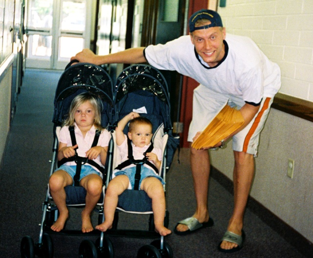Mark Pope of the Denver Nuggets and daughters, Ella and Avery, pause before taking off to pass out materials for the City and County of Broomfield as a Colorado Cares Day 2004 community service on Aug. 31, 2004. 